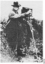 Alfred Watkins taking a photograph